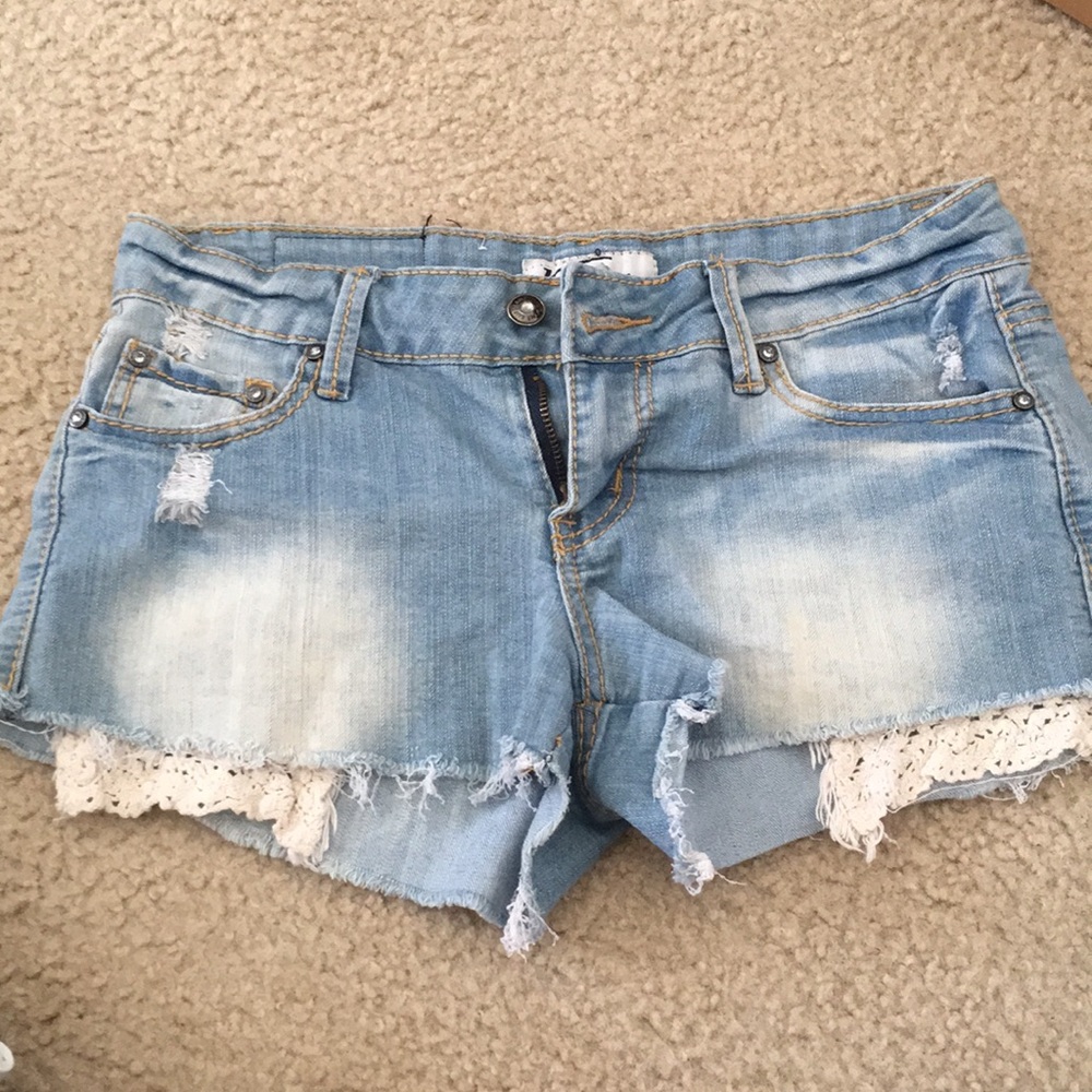 Light distressed jean shorts